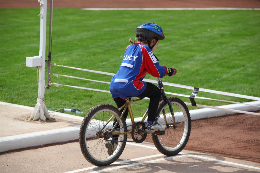 A young girl riding cycle speedway