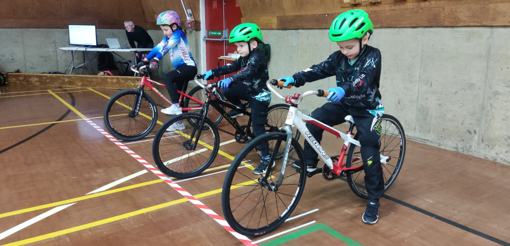 Three youngsters ready to race indoors