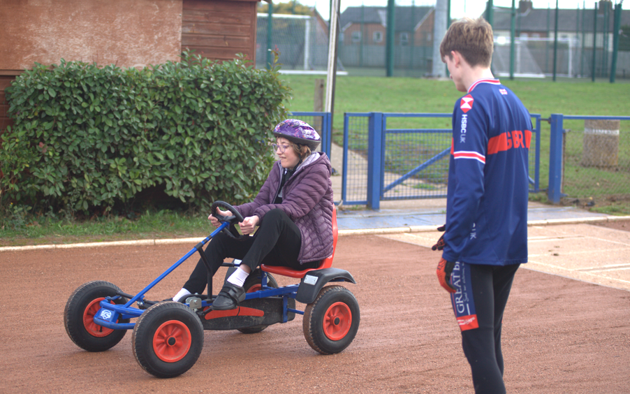 A Thomas Wolsey student tries track riding with a Coach